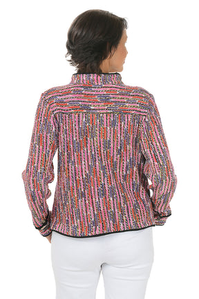 Woman wearing a colorful textured jacket on a white background. Back shot.