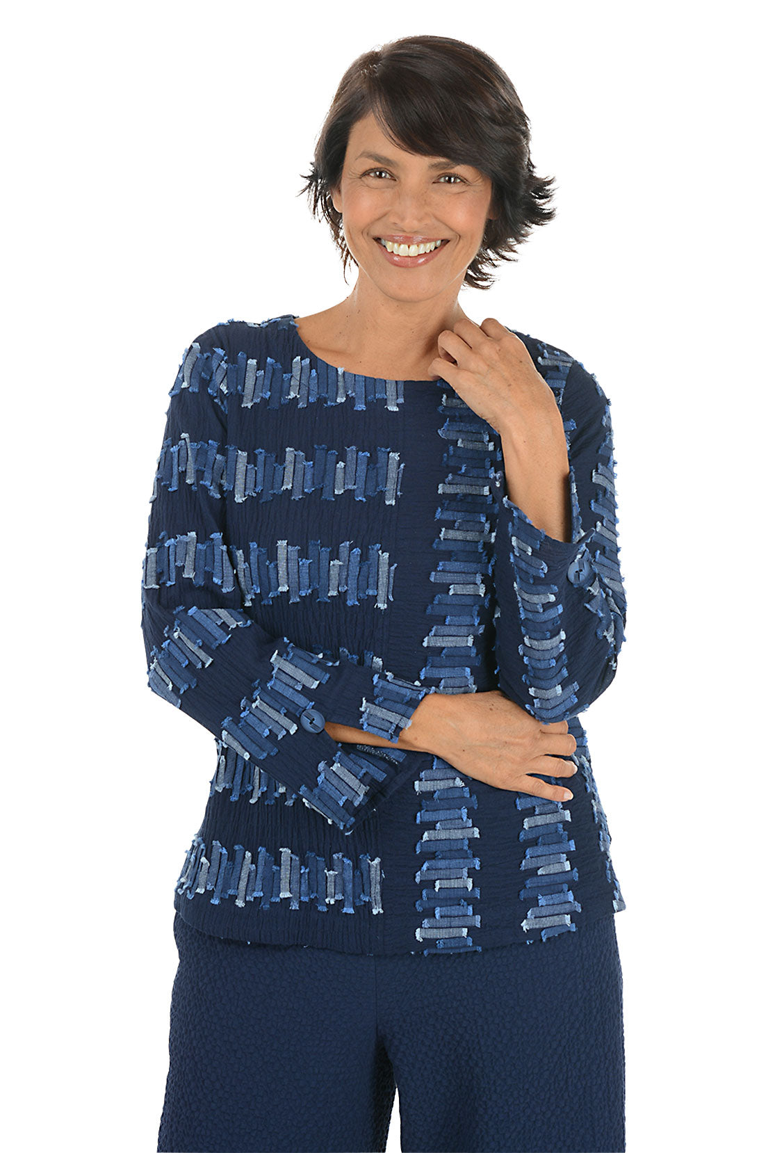 Woman wearing a blue patterned 3/4 sleeve top on a white background.