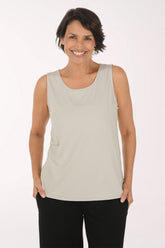 Woman wearing a solid beige tank top