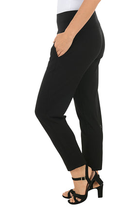 Black ankle pants with a pocket worn by a person on a white background. Side shot.