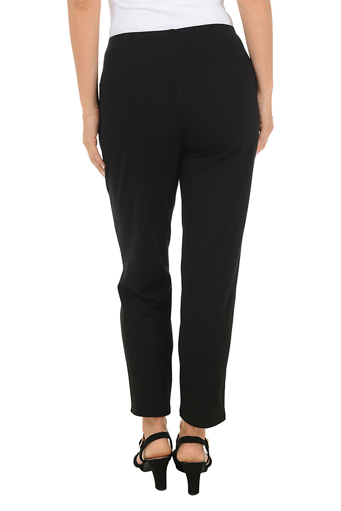 Black ankle pants with a pocket worn by a person on a white background. Back shot.