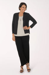 Woman wearing black full length pants 