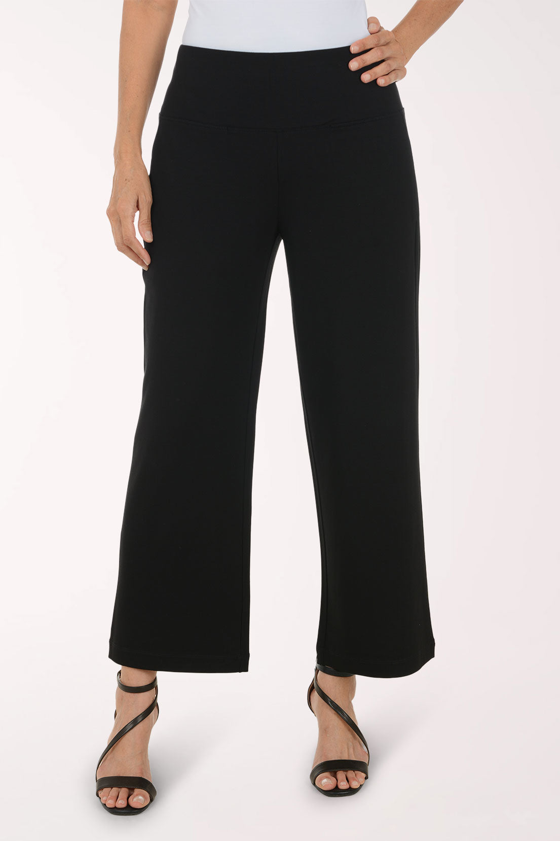 Woman wearing black full length pants 
