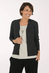 Woman wearing a black and white striped open front jacket 
