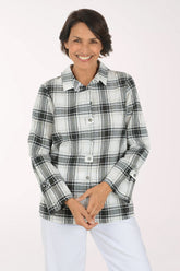 Woman wearing a black and white plaid collared top