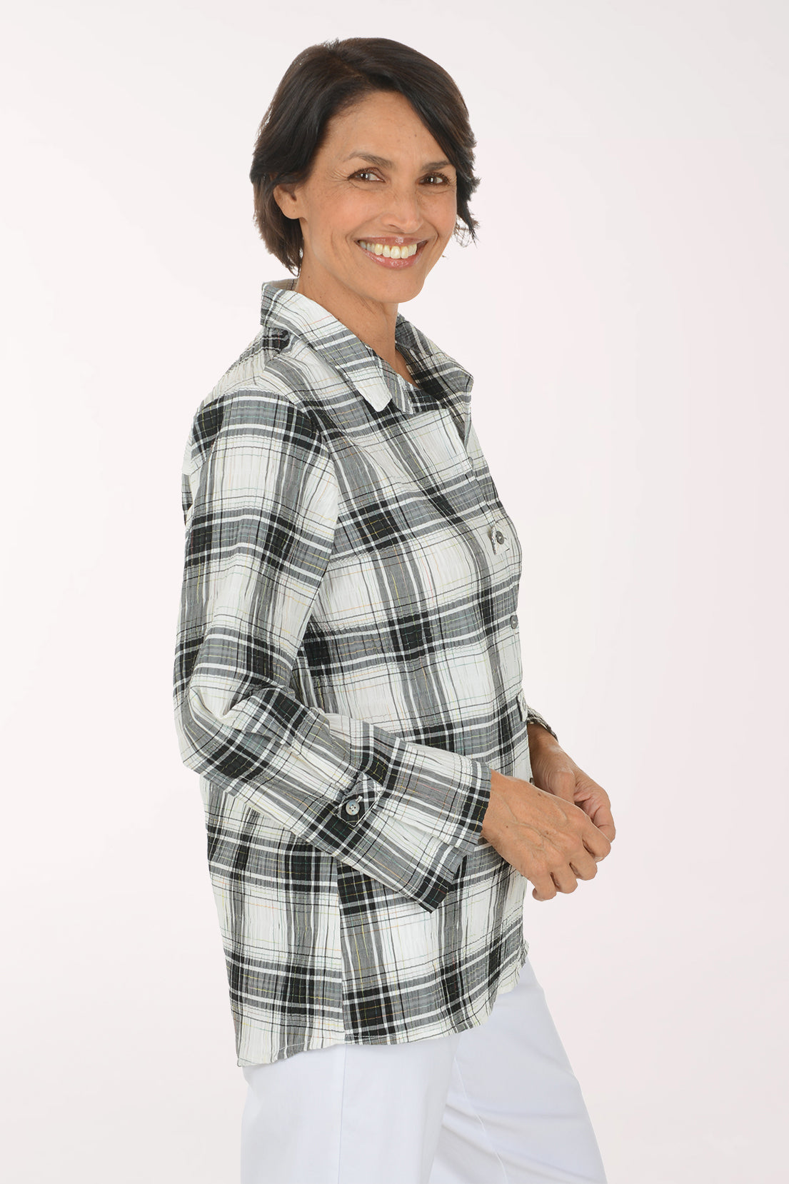 Woman wearing a black and white plaid collared top