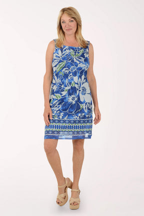 Woman wearing a blue floral dress on a white background