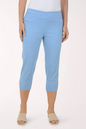 Light blue capri pants worn by a person on a white background