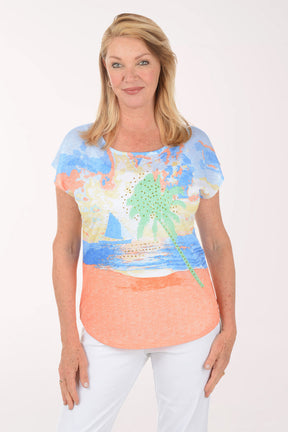 Woman wearing a colorful top with a white background