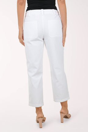 Person wearing white pants with a plain background
