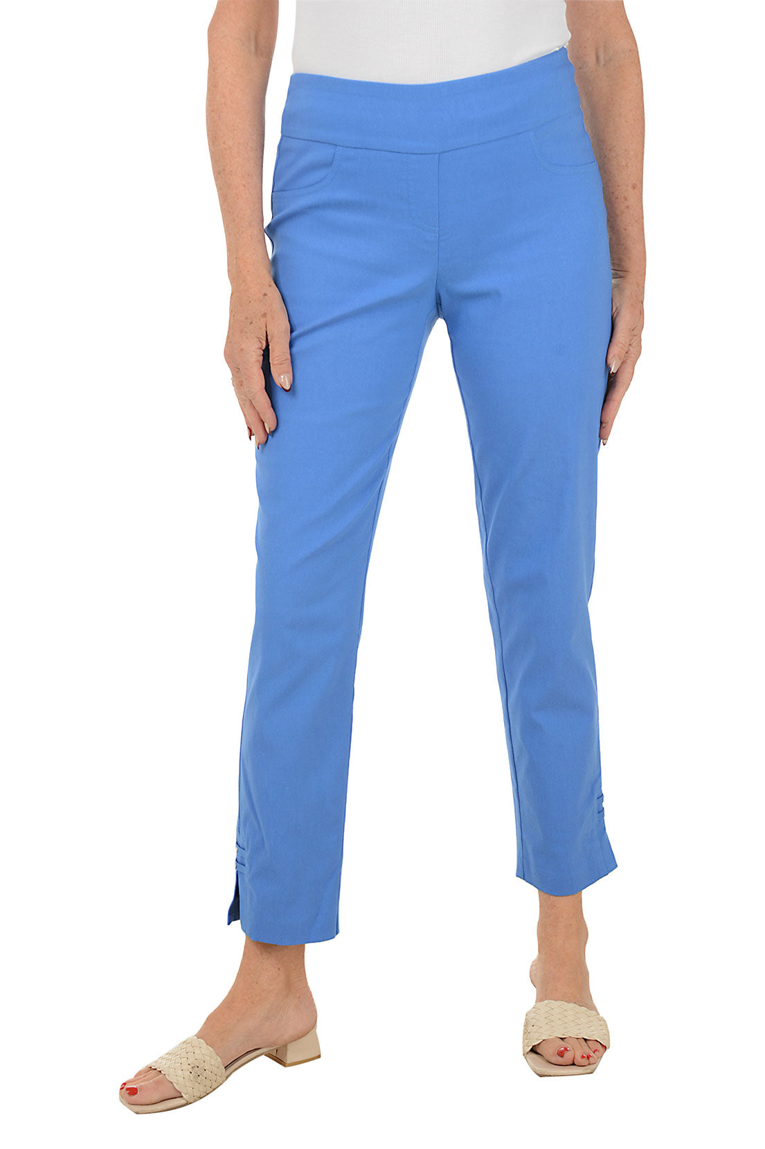 Woman wearing blue pants on a white background.