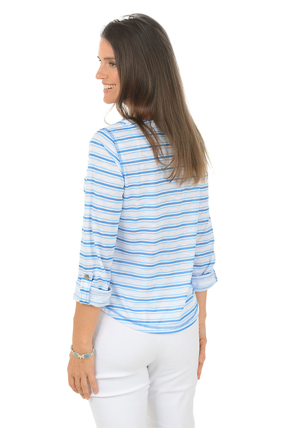 Woman wearing a blue and white striped shirt with a lace-up front, standing against a white background. Back shot.