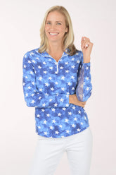 Woman wearing a blue star-patterned shirt on a white background