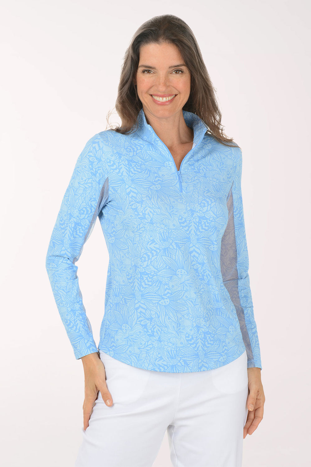 Woman wearing a light blue long-sleeve shirt with mesh accents on a white background