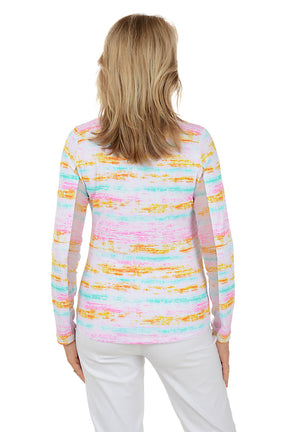 Woman wearing a colorful striped sweater on a white background