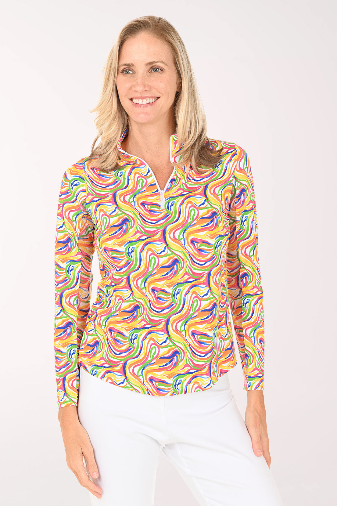 Woman wearing a colorful patterned shirt on a white background