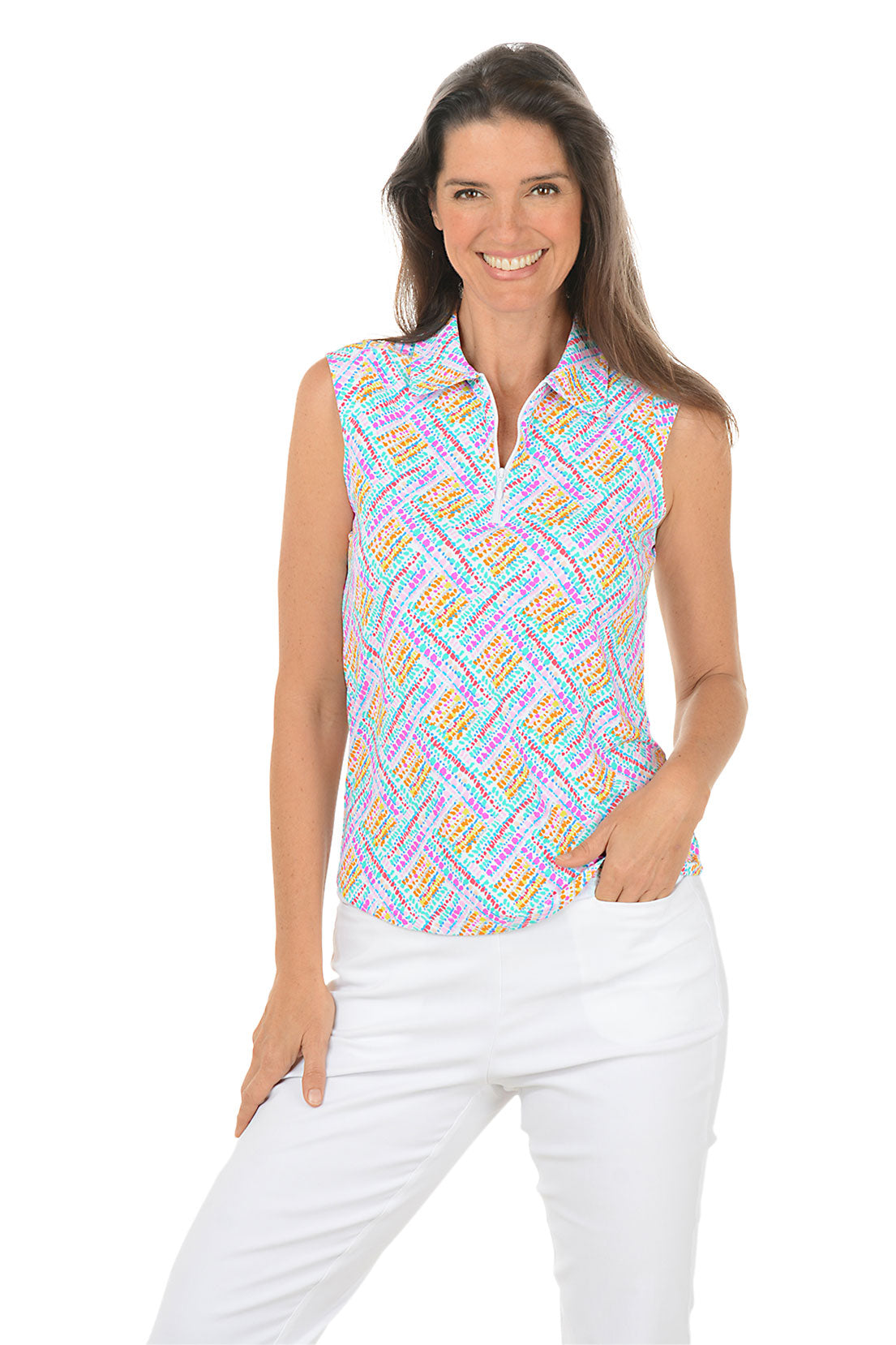 Woman wearing a colorful sleeveless patterned top and white pants on a white background. Second front shot.