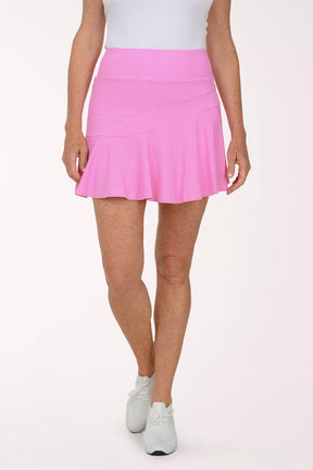 Person wearing a pink skirt on a white background