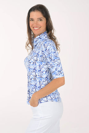 Woman wearing a blue floral patterned shirt on a white background