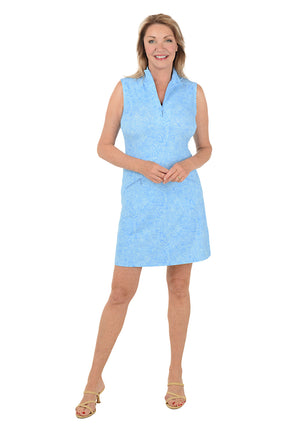 Woman wearing a light blue sleeveless dress on a white background