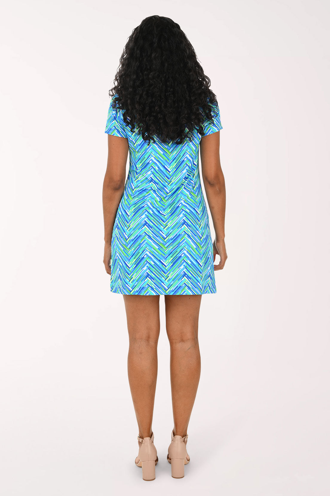 Woman wearing a blue chevron short sleeve dress