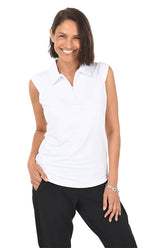 A woman wearing a solid white sleeveless polo top with a classic foldover polo collar and half-zip neckline, paired with black pants.