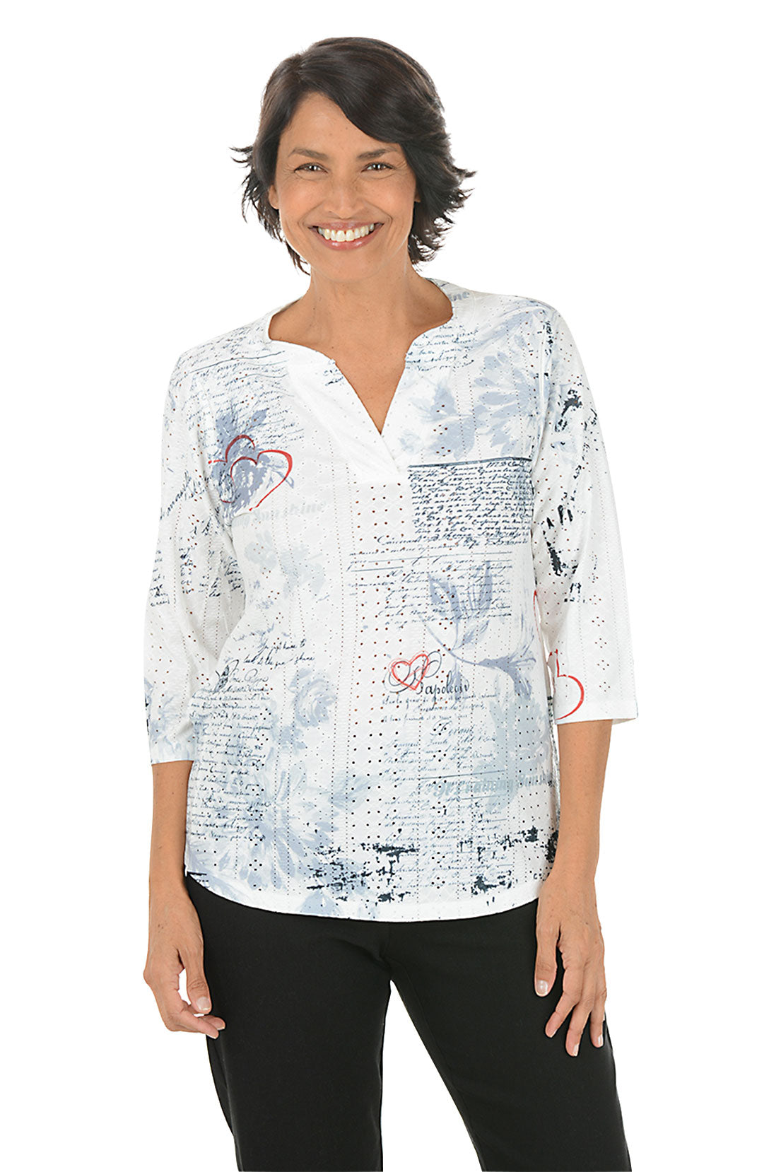 Woman wearing a white blouse with floral and text pattern on a white background