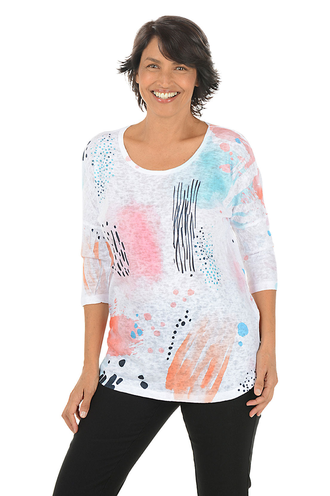 Woman wearing a colorful abstract patterned top on a white background. Second front shot.