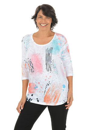 Woman wearing a colorful abstract patterned top on a white background. Second front shot.