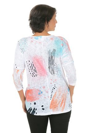 Woman wearing a colorful abstract patterned top on a white background. Back shot.