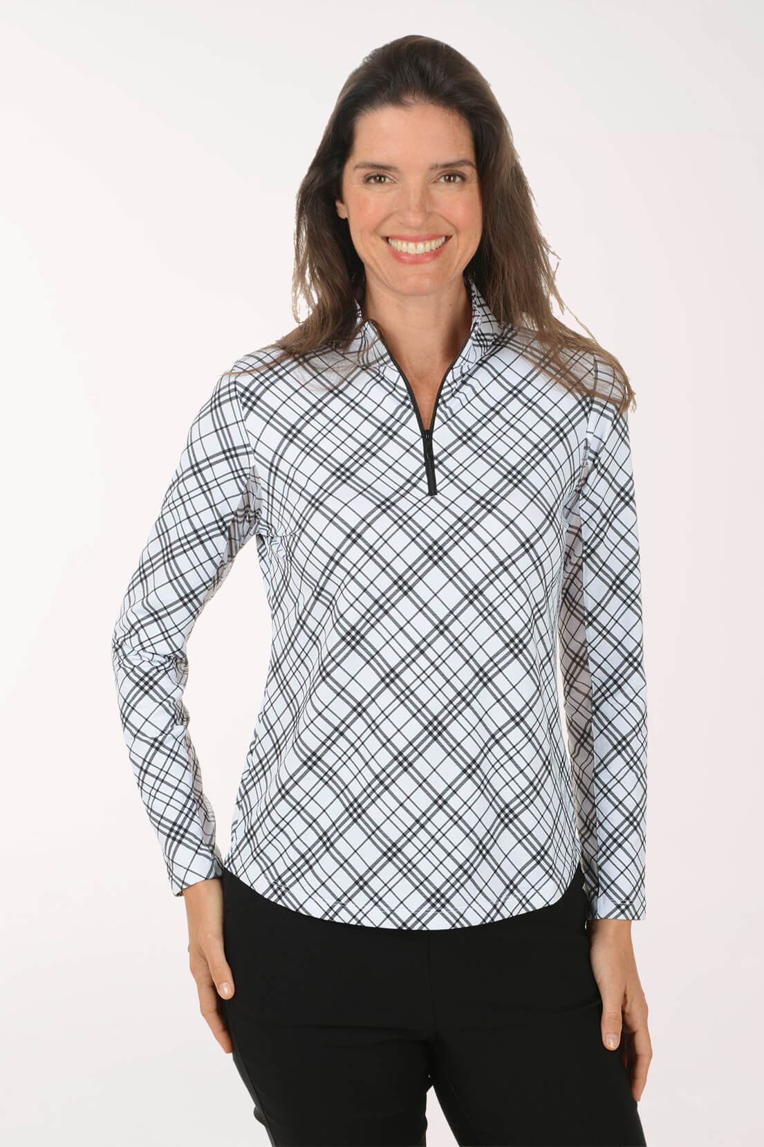 Woman wearing a plaid patterned shirt on a white background