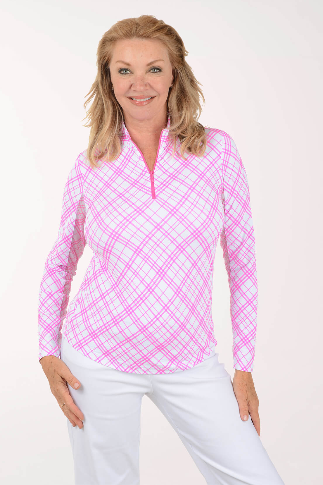 Woman wearing a pink and white checkered long-sleeve shirt on a white background