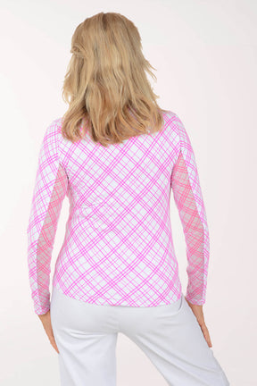 Woman wearing a pink plaid long-sleeve top on a white background