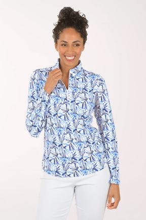 Woman wearing a blue floral patterned blouse on a white background