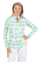 Woman wearing a colorful checkered shirt with a white background.