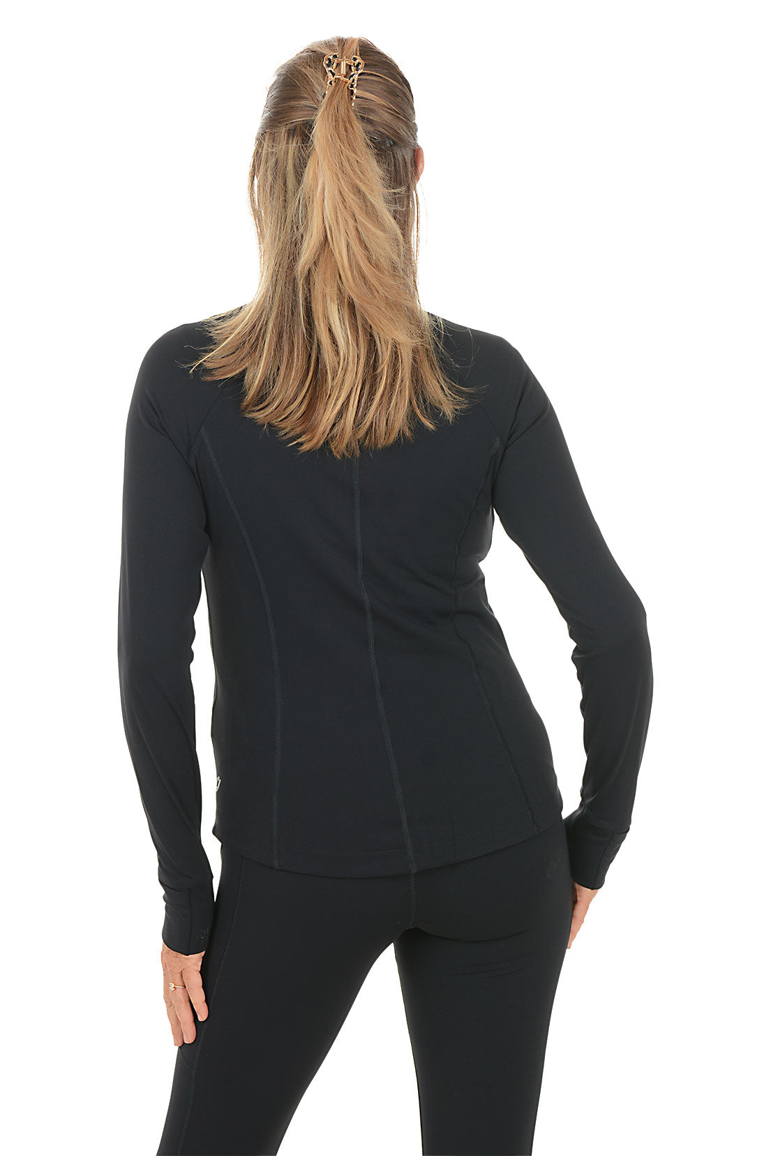 Woman wearing a black zip-up jacket and pants on a white background. Back shot.