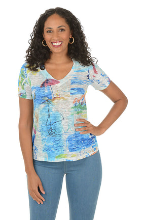 Woman wearing a colorful patterned shirt with a white background.