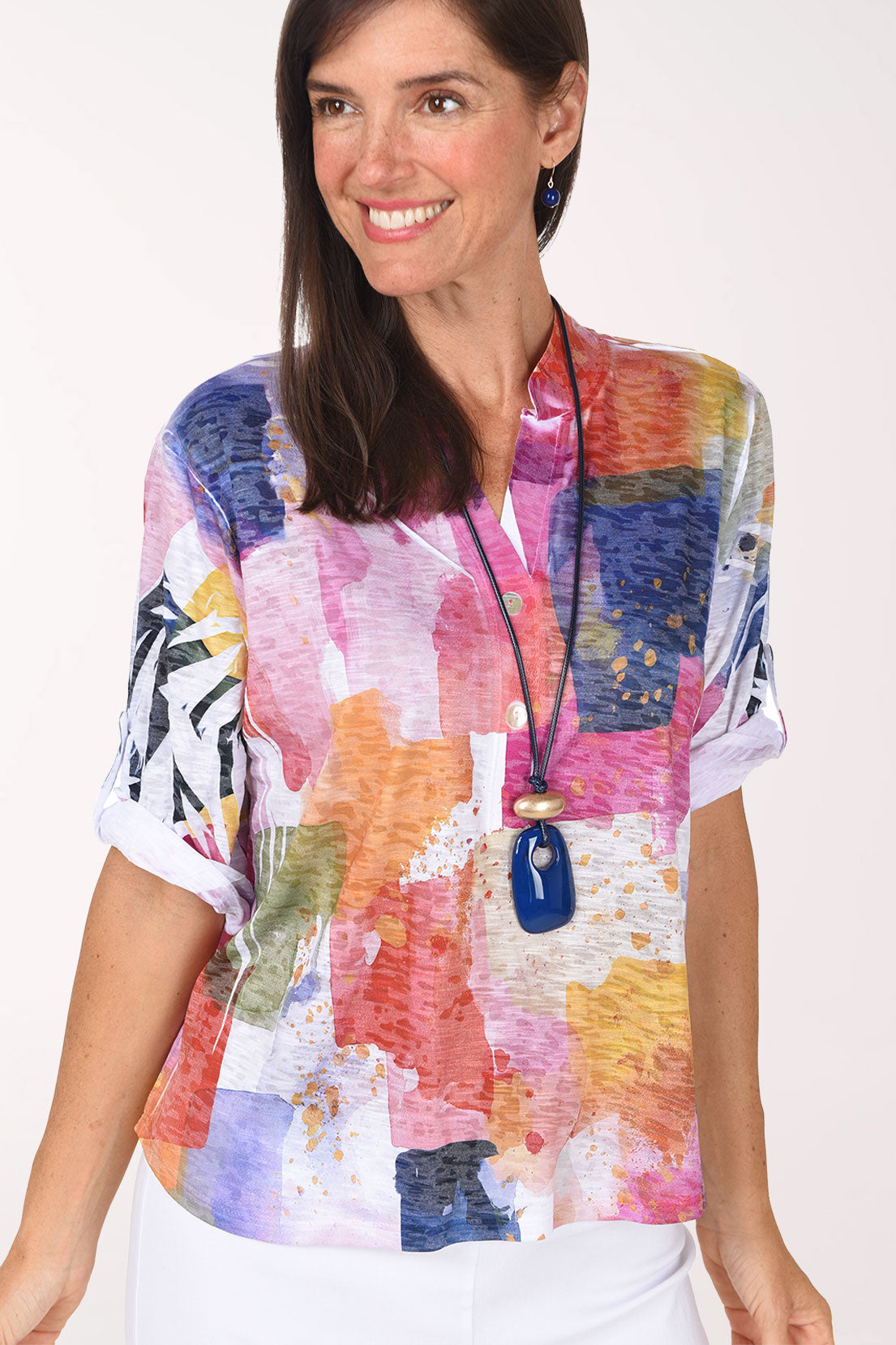 Close-up of the mandarin collar and split V-neck with double button placket on the Prism Blocks High-Low Knit Top