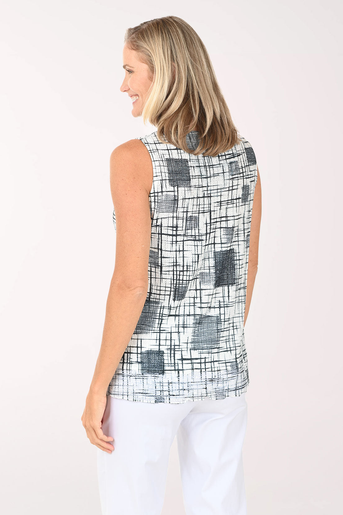 Woman wearing a black and white sleeveless top