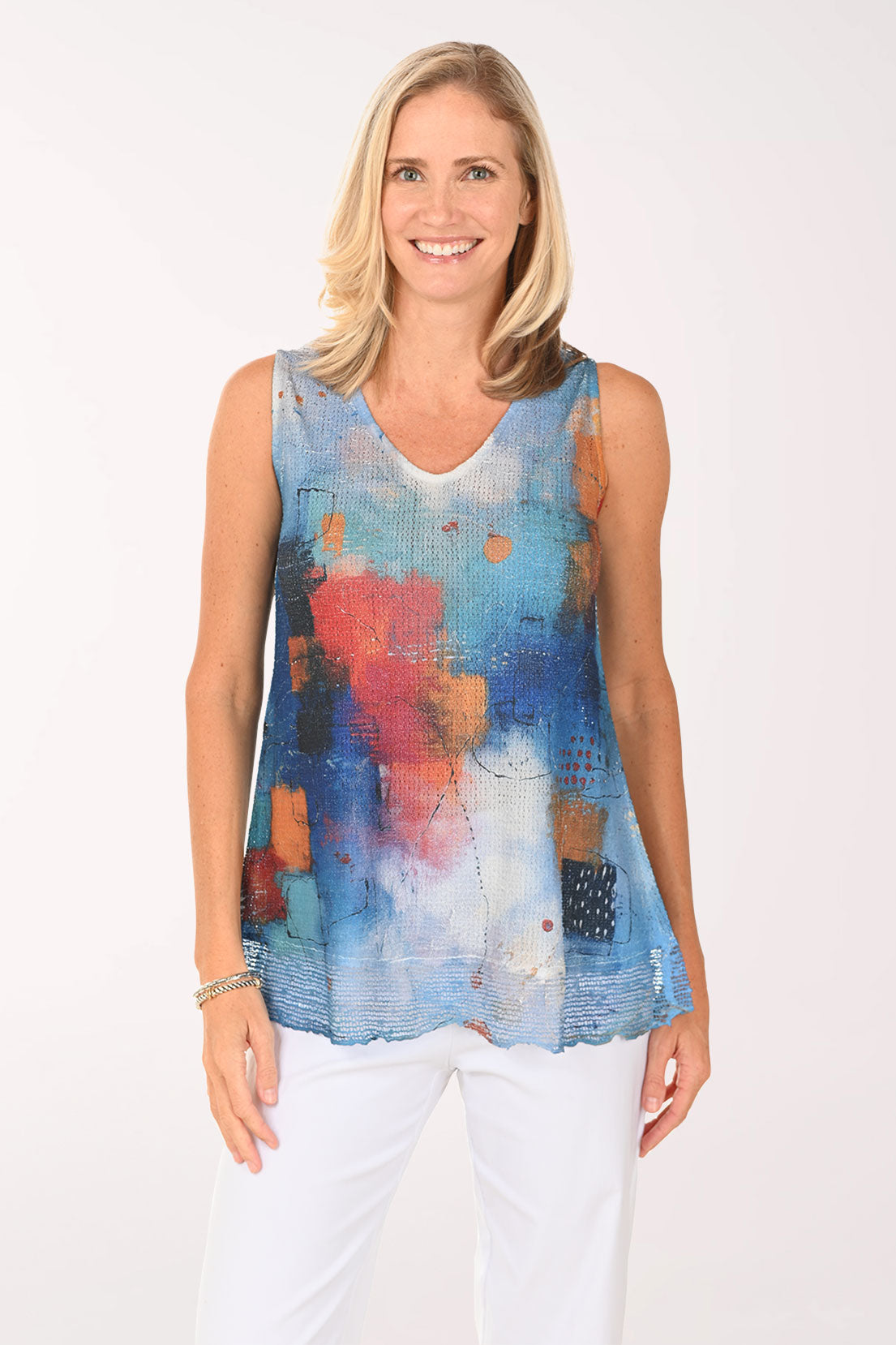 Woman wearing a multi colored sleeveless top