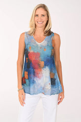 Woman wearing a multi colored sleeveless top