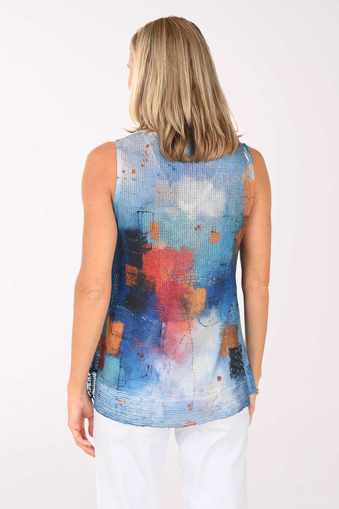 Woman wearing a multi colored sleeveless top