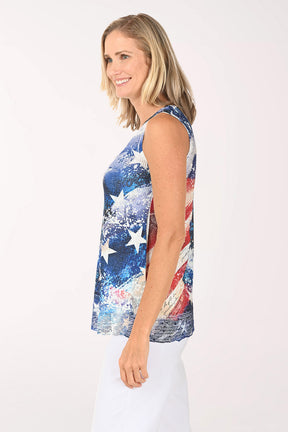Woman wearing a sleeveless top with a colorful American flag design on a white background