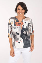 Woman wearing a shirt with animal prints on a white background