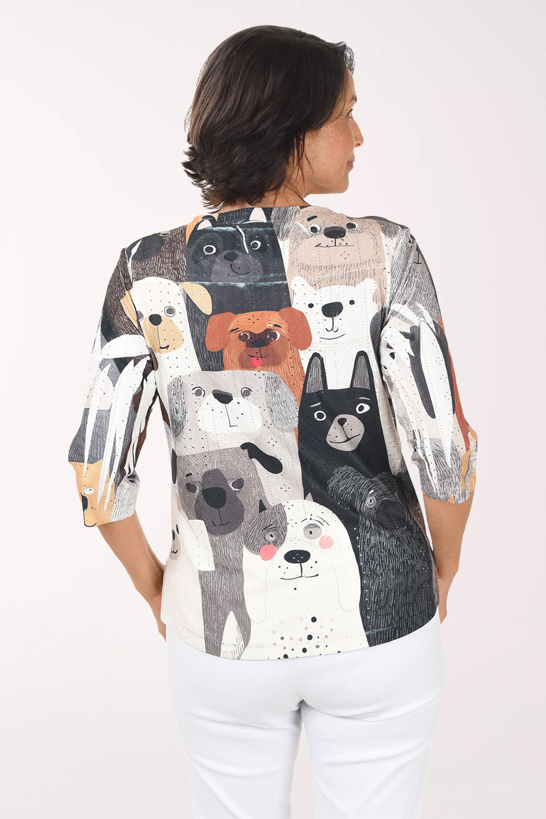 Woman wearing a shirt with animal prints on a white background