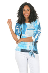 Woman wearing a blue patterned shirt on a white background.