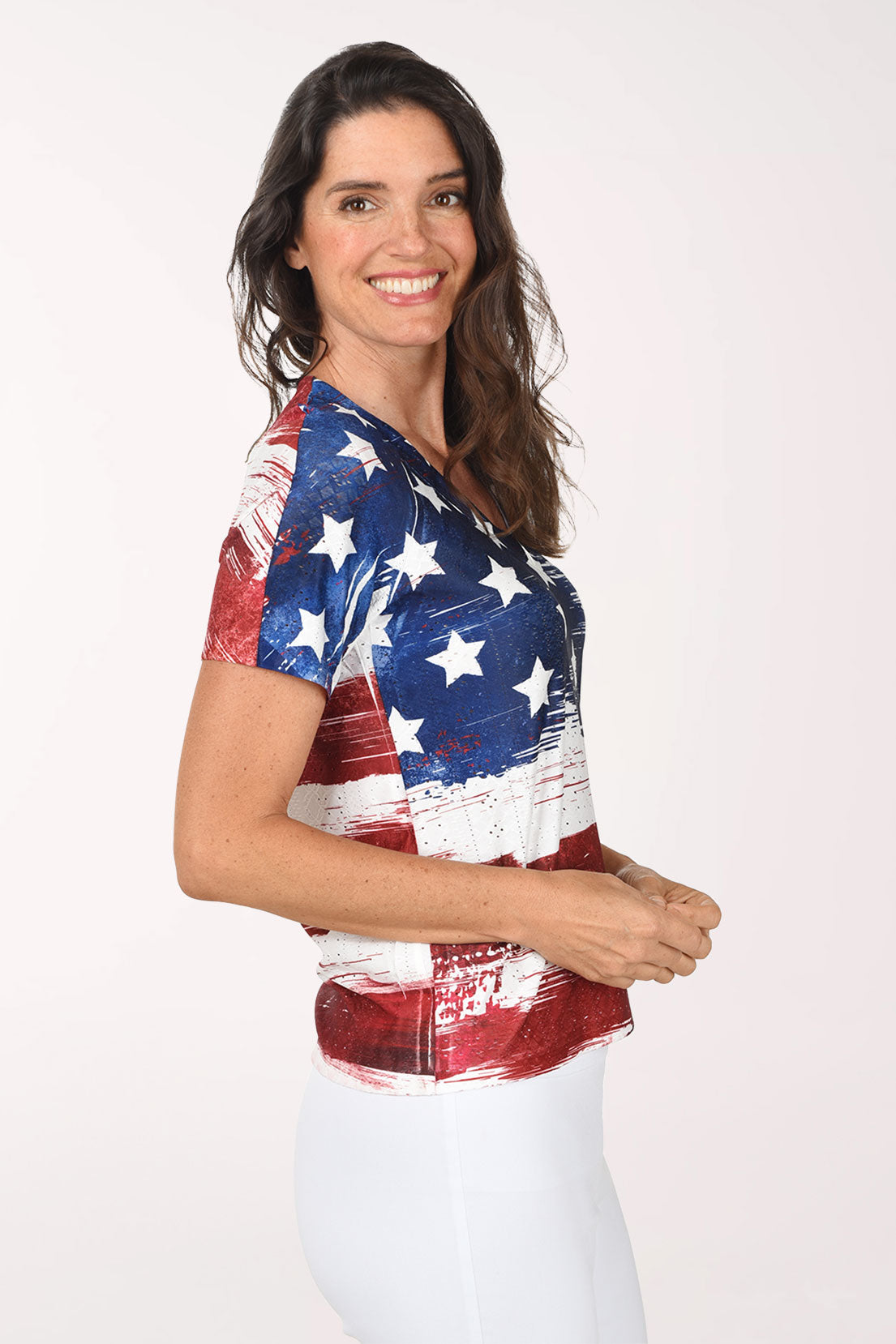Woman wearing a t-shirt with an American flag design on a white background