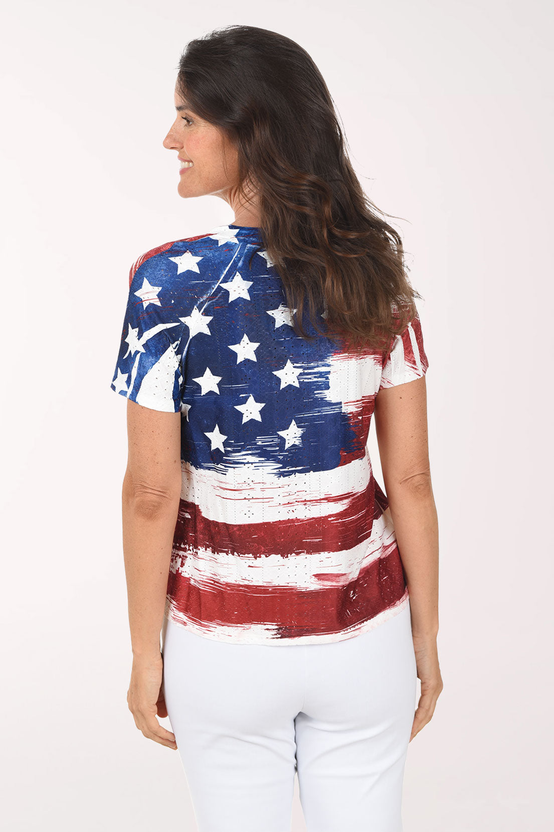 Woman wearing a t-shirt with an American flag design on a white background