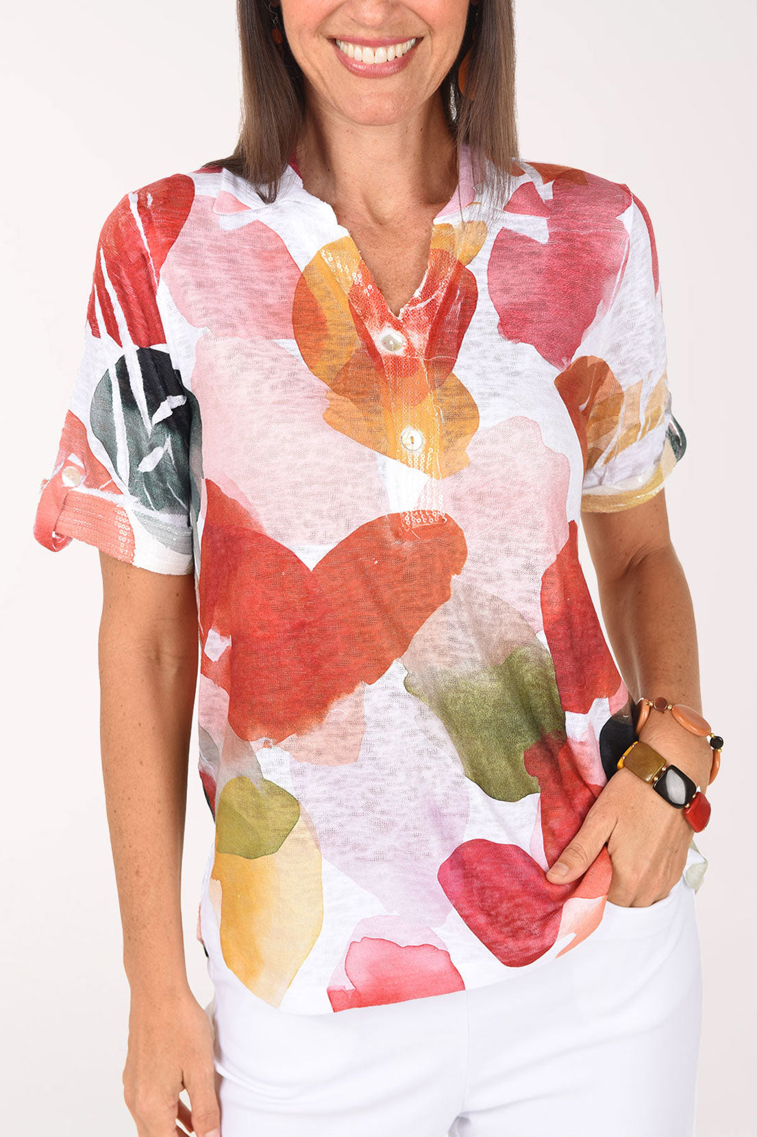 Close-up of the folded collar and petal print on the Drifting Petals Sequin Accented Polo Top
