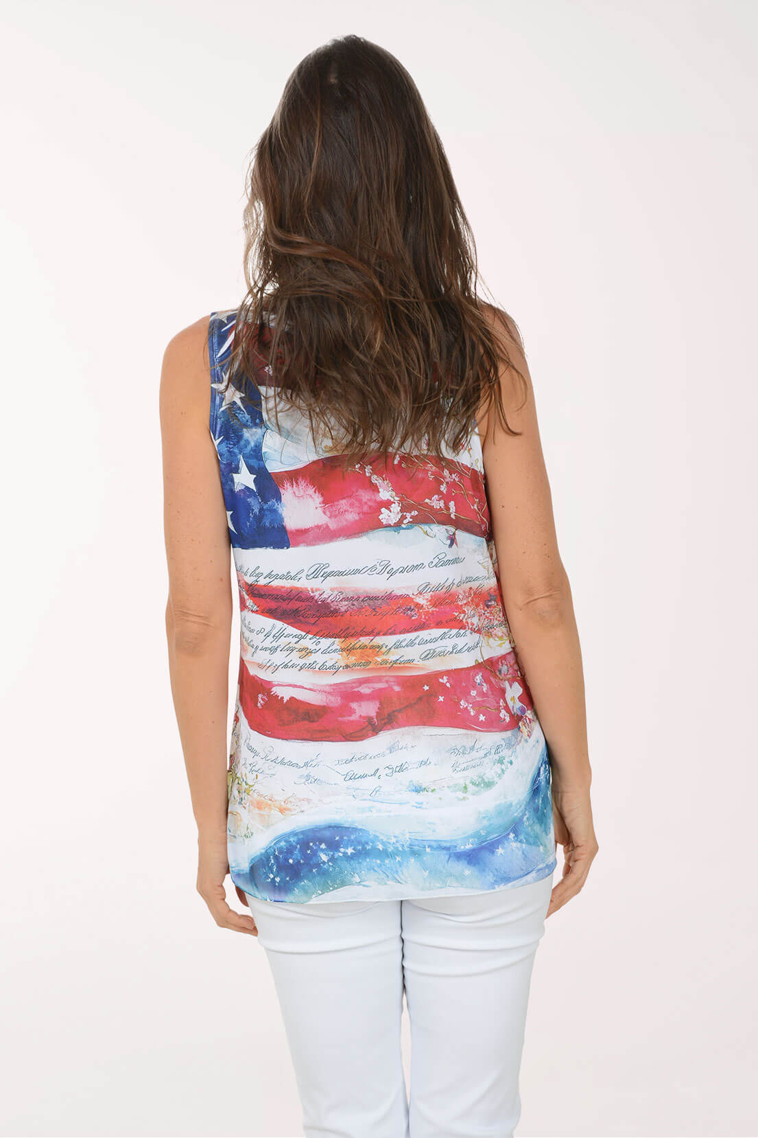 Woman wearing a sleeveless top with an American flag design on a white background